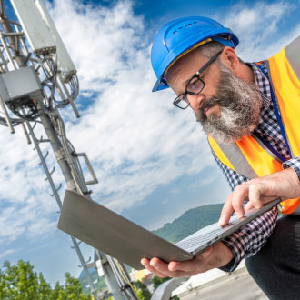 cell tower with technician